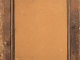 an old wooden frame with a brown paper on it