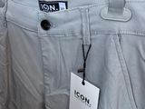 a close up of a pair of pants hanging on a rack