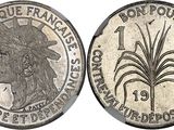 a silver coin with the image of a woman in a headdress and a palm tree