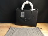 the bag is sitting on the table next to the bag