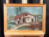 an oil painting of a house on a easel in front of a black background