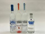 three bottles of absolut vodka and a bottle of absolut vodka