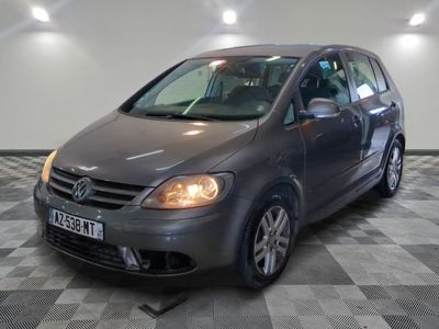 a picture of a grey car parked in a garage