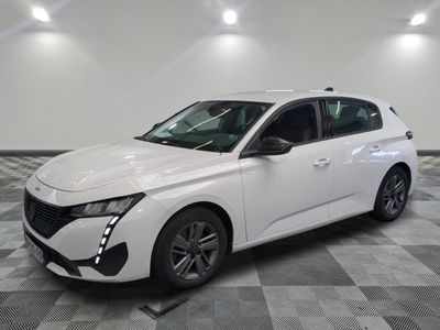 the white car is parked on a checkered tile floor