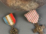 two medals are sitting next to each other on a table