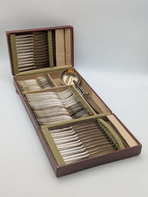 a wooden box with a set of silverware in it