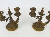 pair of antique brass candlesticks with birds on them