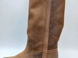 a close up of a pair of brown boots on a white background