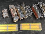 five model trains sitting next to each other on a table