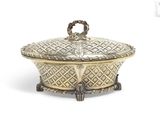 an antique silver plate covered dish with a handle and handles
