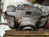 a camera that is sitting on top of a piece of wood