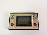 an old game console sitting on top of a white table