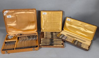 four different types of silverware in a case on a table
