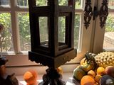 many different types of fruit on the table by the window