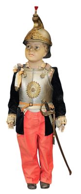 an image of a doll of a boy dressed as a soldier