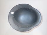 a black bowl sitting on a table with a white background
