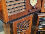 several old radio ' s are stacked on top of each other in a room