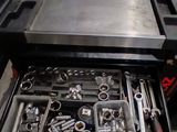 many tools in a tool box in the garage