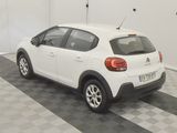 a white car that is parked in a garage