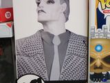 a box with a picture of a man in a suit and tie next to a box with a picture of a man in a suit and tie