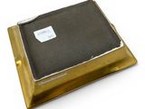 a black and gold box with a label on it