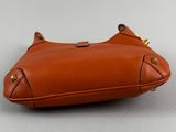 an image of a brown leather purse with a gold clasp