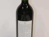 a bottle of wine that is sitting on a table