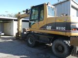 a picture of a construction vehicle parked in front of a building