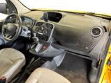 a small yellow car with a steering wheel and dashboard