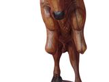 statue of a bull with horns on a wooden base