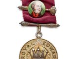 une image représentant une médaille sur laquelle figure le portrait d'un homme coiffé d'une couronne