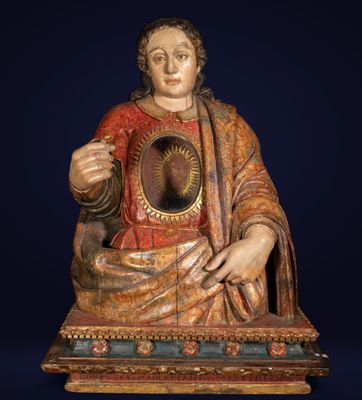 an image of a statue of jesus holding a mirror in his hands