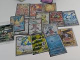 a lot of pokemon cards sitting on a table