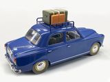 a toy car with luggage on top of it