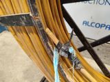 a close up of a yellow hose on the ground