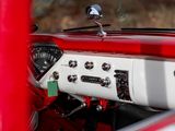 a red and white car dashboard with a clock on it
