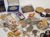 a lot of medals and other items on the table
