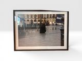 a picture of a picture of a woman walking in the rain