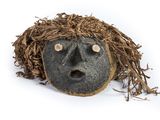 an image of a face made out of a piece of wood