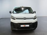 citroen van parked in a showroom with white walls and black flooring