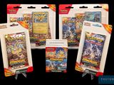 three packs of pokemon trading cards are shown on a black background