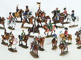 many figurines of men riding horses and holding flags
