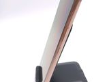 a close up of a cell phone on a stand