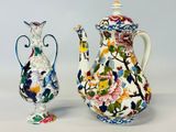 two vases sitting next to each other on a table