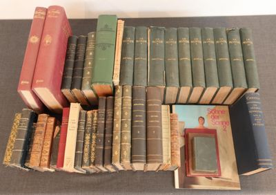 a lot of books that are sitting on a table