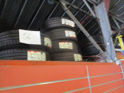 several tires stacked on top of each other in a warehouse