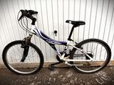 a bike that is parked in front of a building