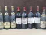 several bottles of wine are lined up on a table