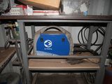 a blue box sitting on top of a shelf in a room