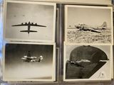 several black and white photos of airplanes in a display case